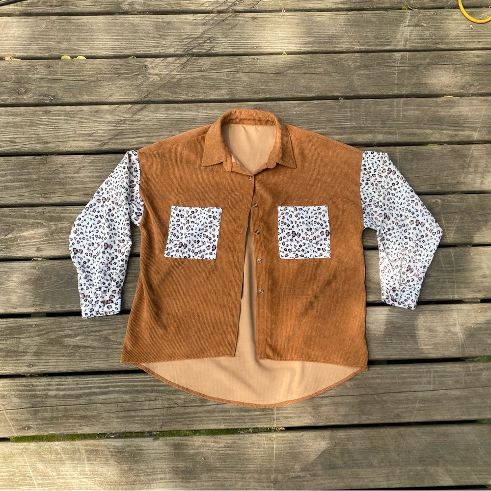 SHEIN corduroy button up shirt with cheetah print sleeves.